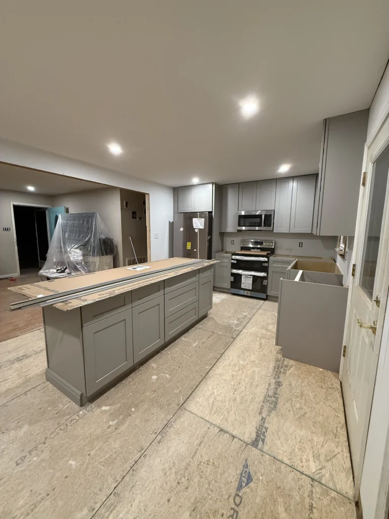 Open-concept kitchen remodel nearing completion with new gray cabinetry in Abingdon, VA