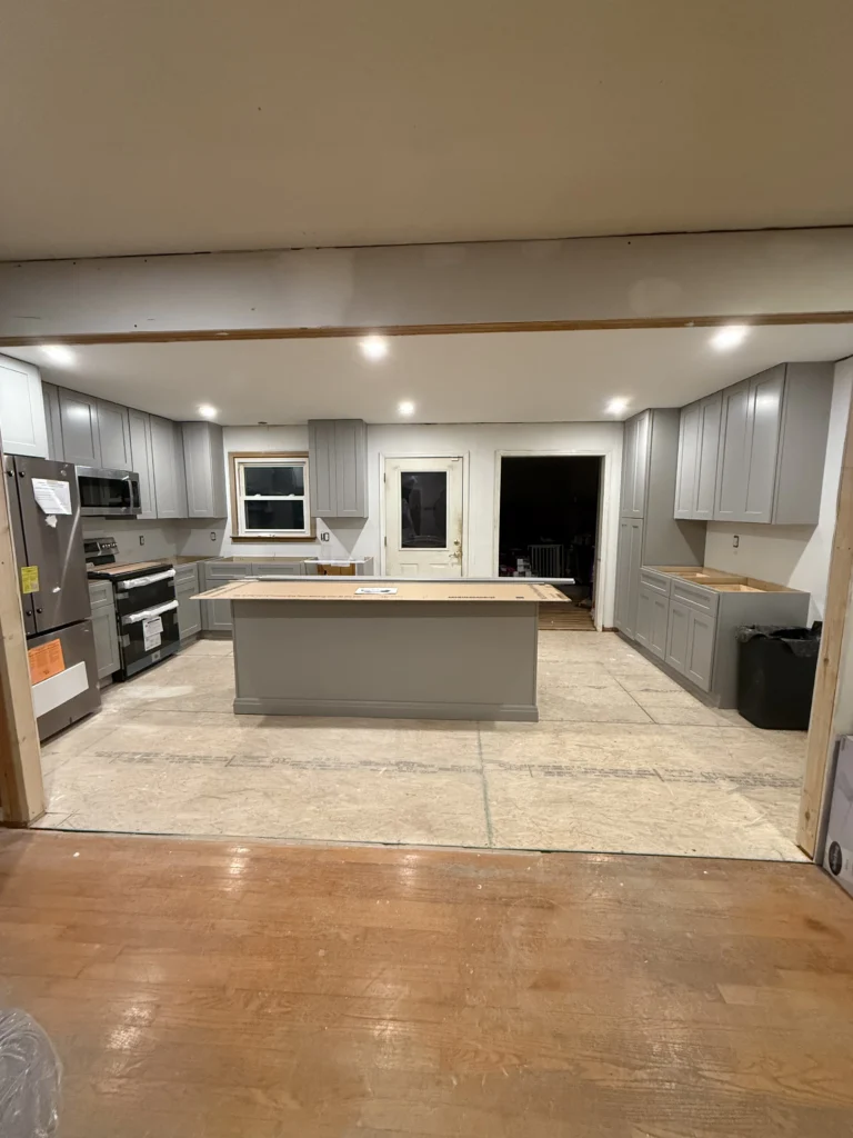 Kitchen remodel in progress with new gray cabinets and island installation in Abingdon, VA