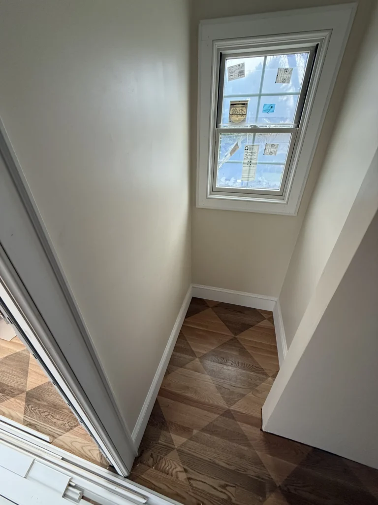 Small room featuring custom geometric hardwood flooring and window trim in Bristol, VA