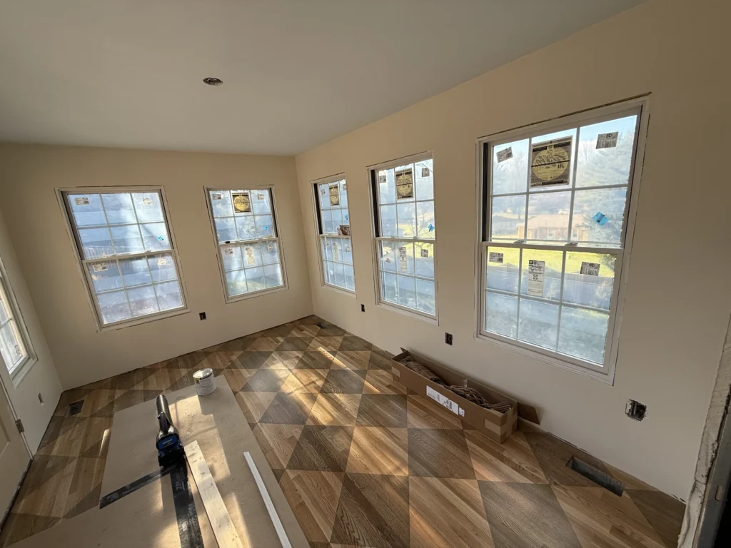 Geometric hardwood flooring with custom window and trim installation in Bristol, VA