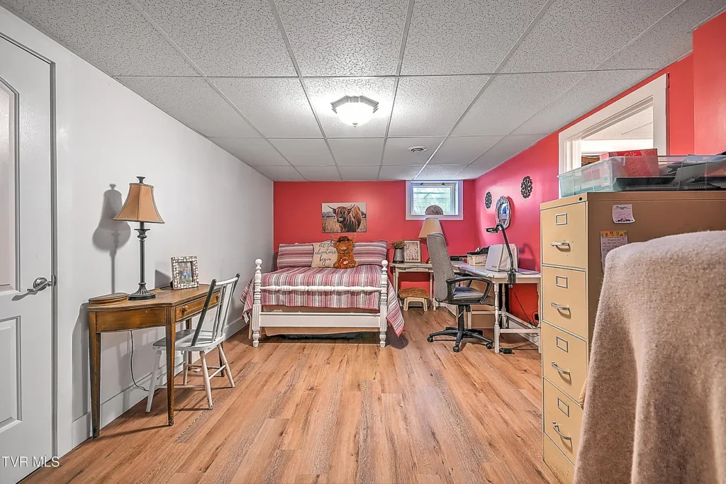 Basement bedroom and home office setup in Afton basement remodel