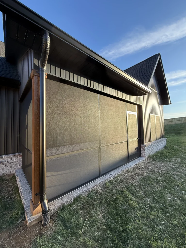 Finished screened porch with black aluminum framing on a new construction home in Gray, TN