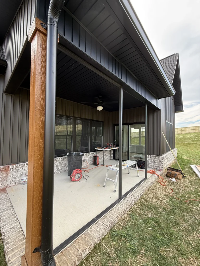 Screened porch framing during installation on a covered patio in Gray, TN