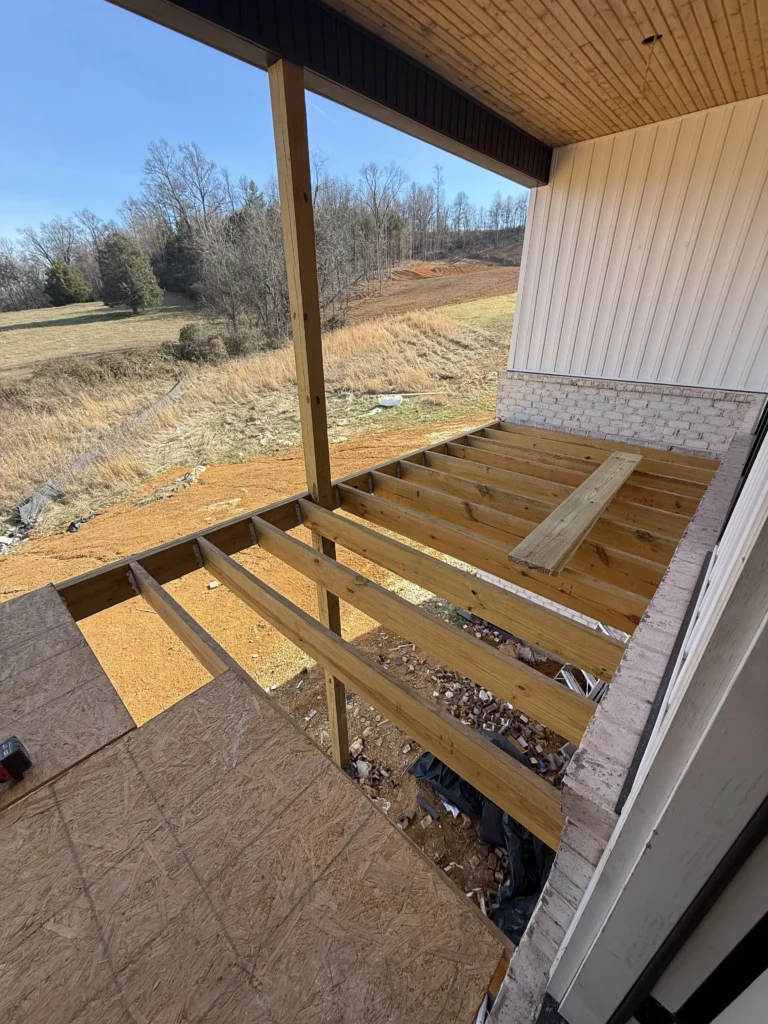 New construction covered porch framing before Trex deck installation in Gray, TN