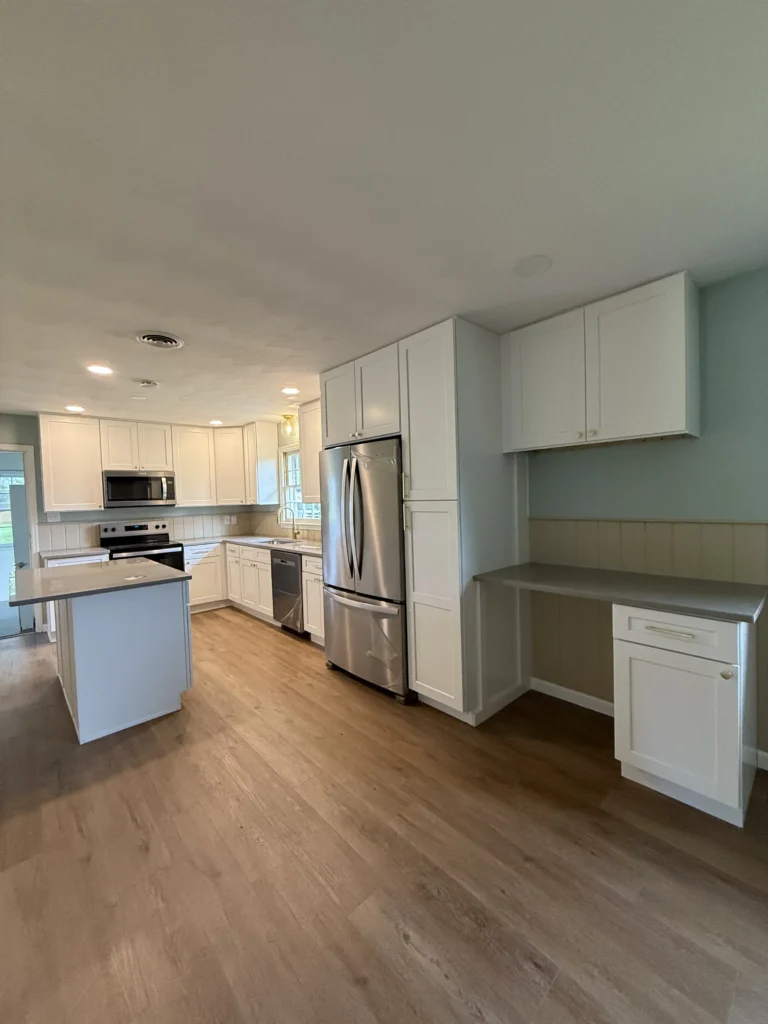 Johnson City kitchen remodel with white shaker cabinets and quartz island