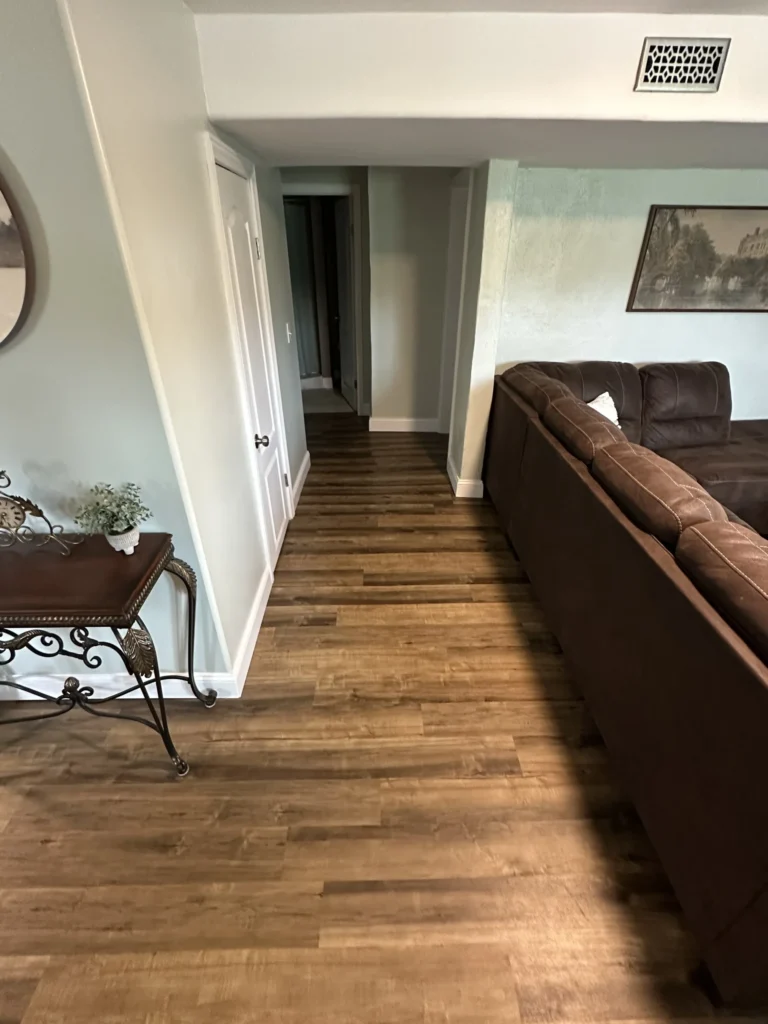Wood accent wall and LVP flooring detail in Johnson City basement remodel