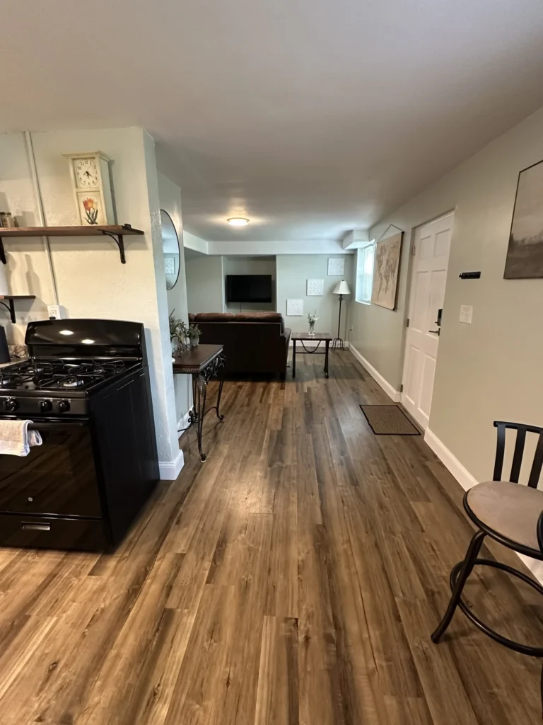 LVP flooring installed in kitchenette and dining nook in Johnson City basement remodel