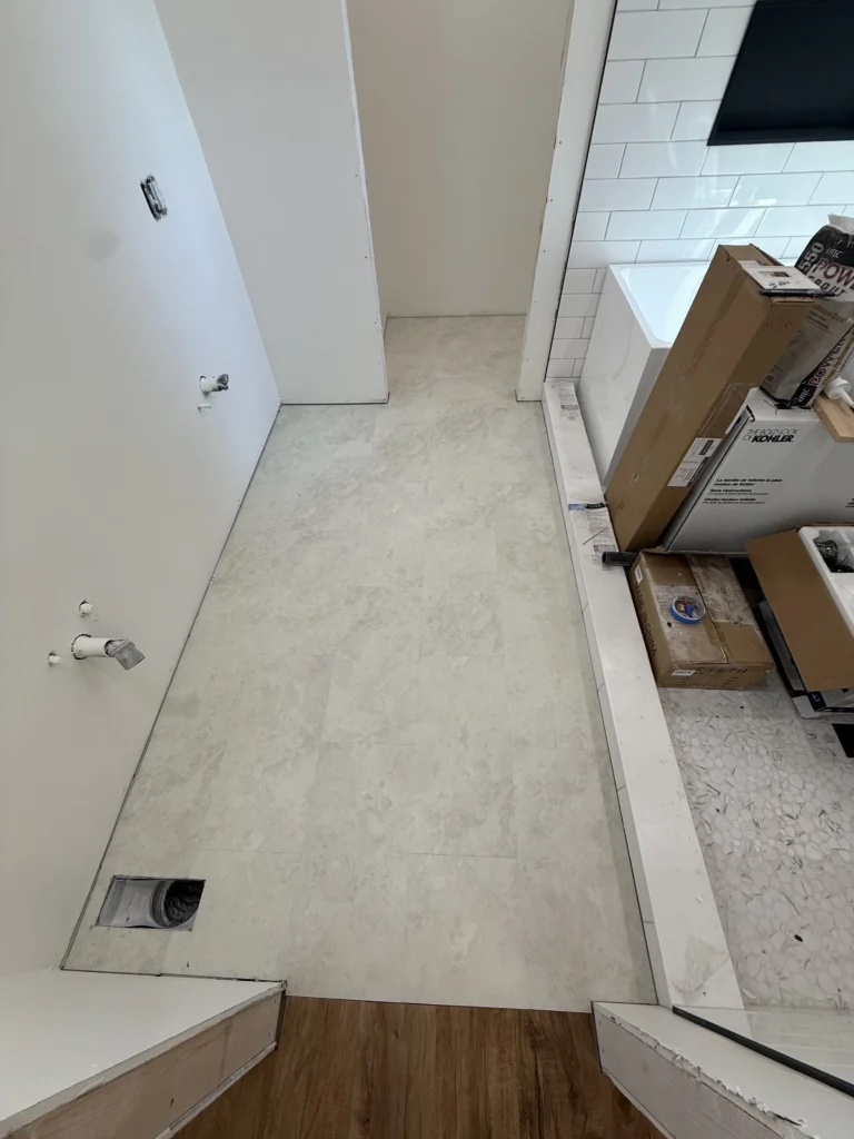Construction progress inside a Piney Flats, TN master bathroom remodel before vanity installation