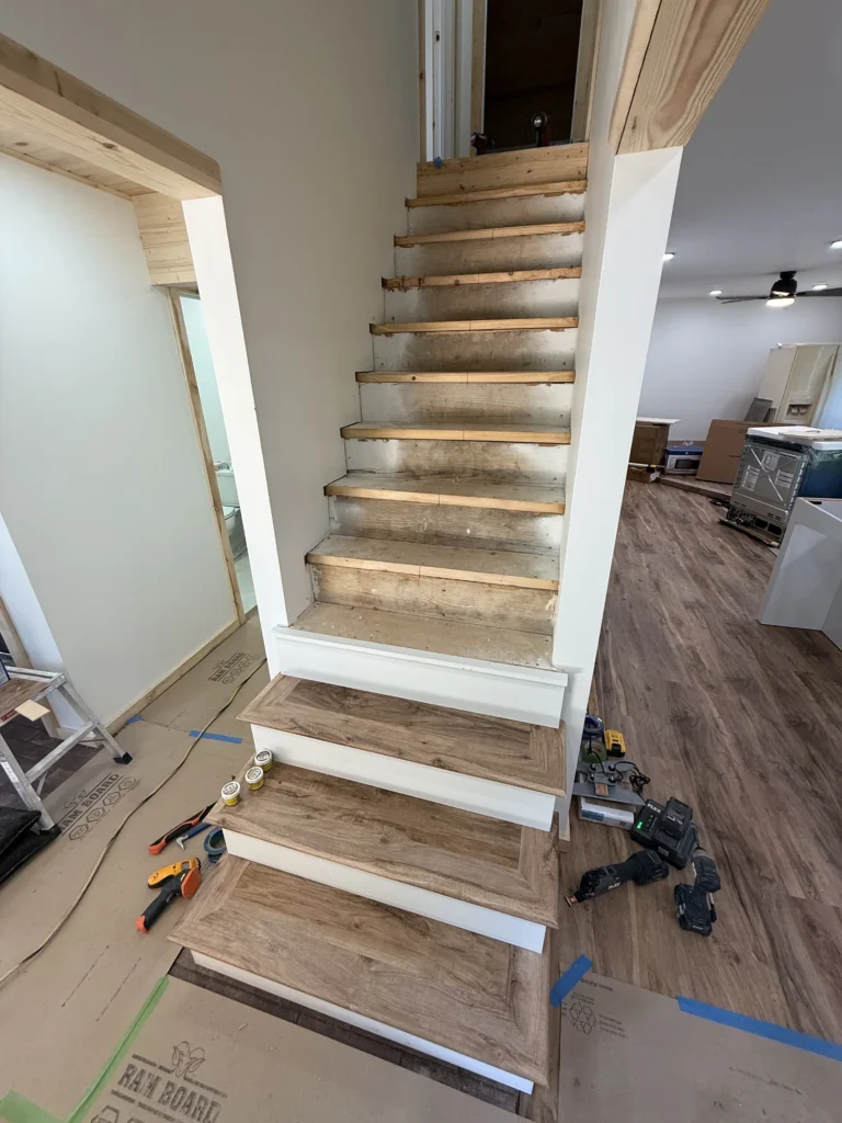 Staircase before new tread installation in Piney Flats remodel