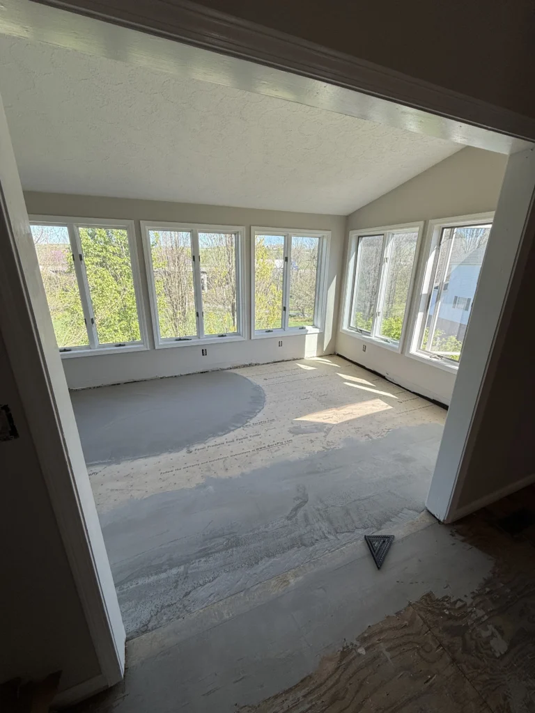 Sunroom subfloor preparation before flooring install in Kingsport whole home remodel